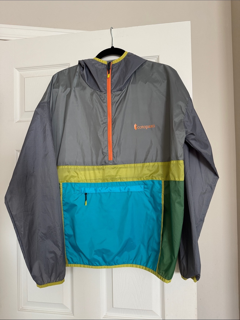 Cotopaxi Gray Windbreaker with Teal Pocket and Lime Trim